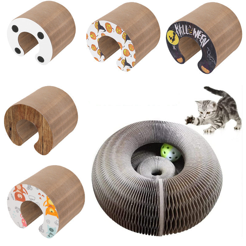 Collection of cat toys including cardboard tubes and a corrugated wheel with a cat playing.